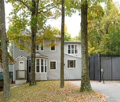 The exterior of the gray cottage at the Altobello Campus
